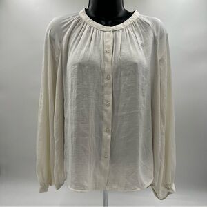 A new day cream  soft button down flowy shirt size XS. can be dressed up or down